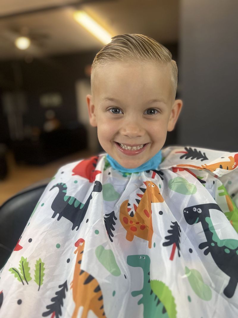 Kids fade with a clean side part at AJ23 Barbershop
