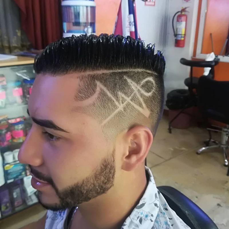 Freestyle hair design on a high fade