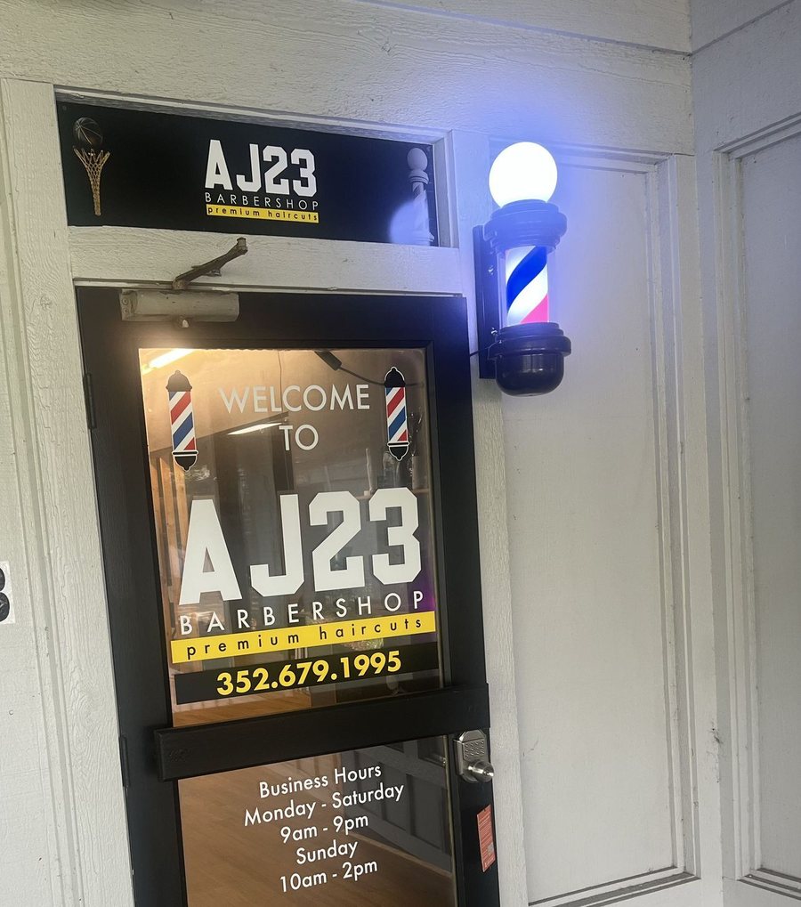 Entrance to AJ23 Barbershop, unit 6B — look for the barber pole